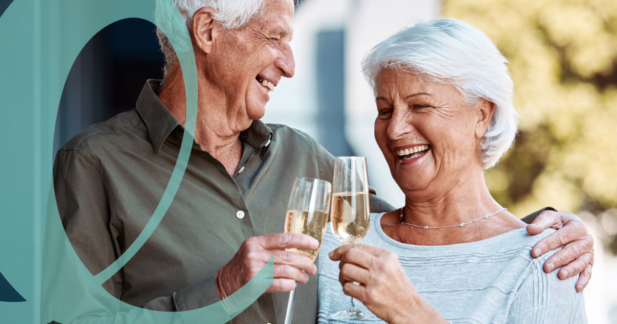 Older couple toasting champagne