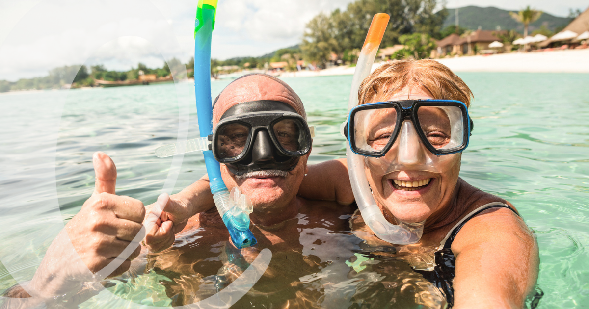 Older adults snorkeling -Travel by Leisure Care